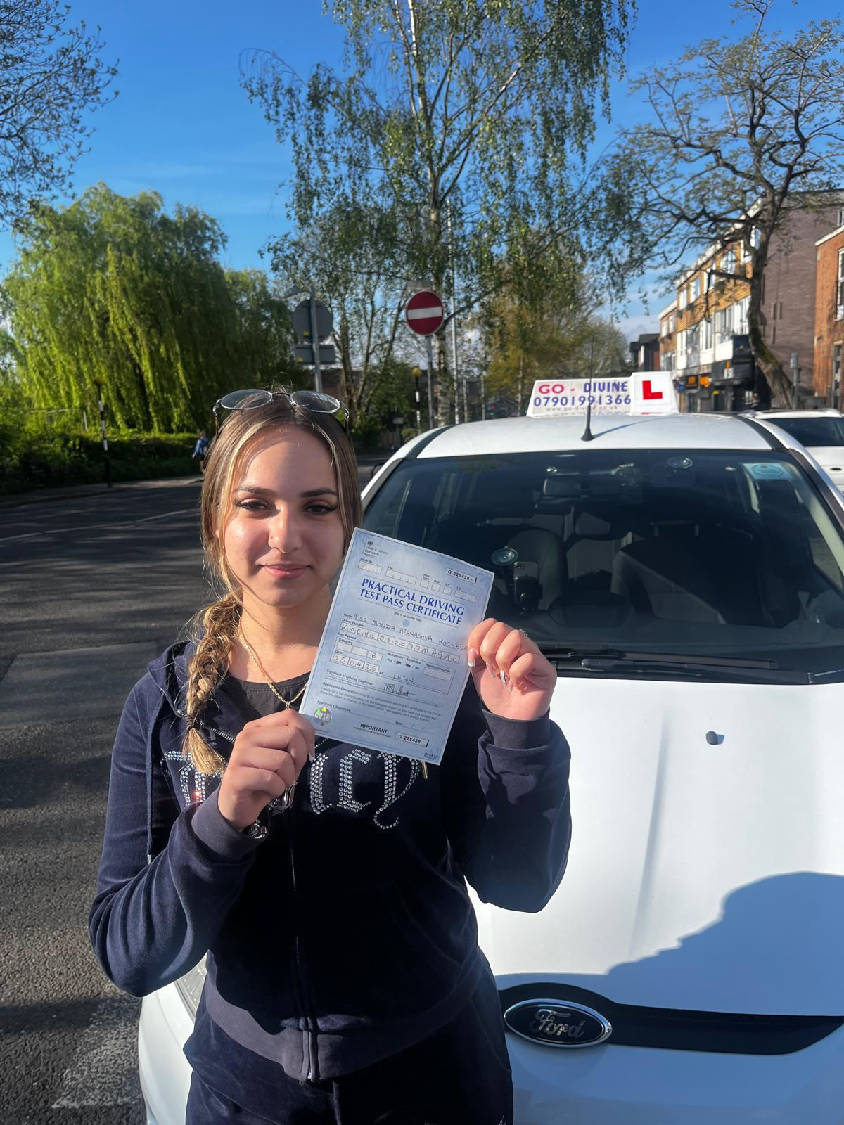 Happy student with driving test pass certificate