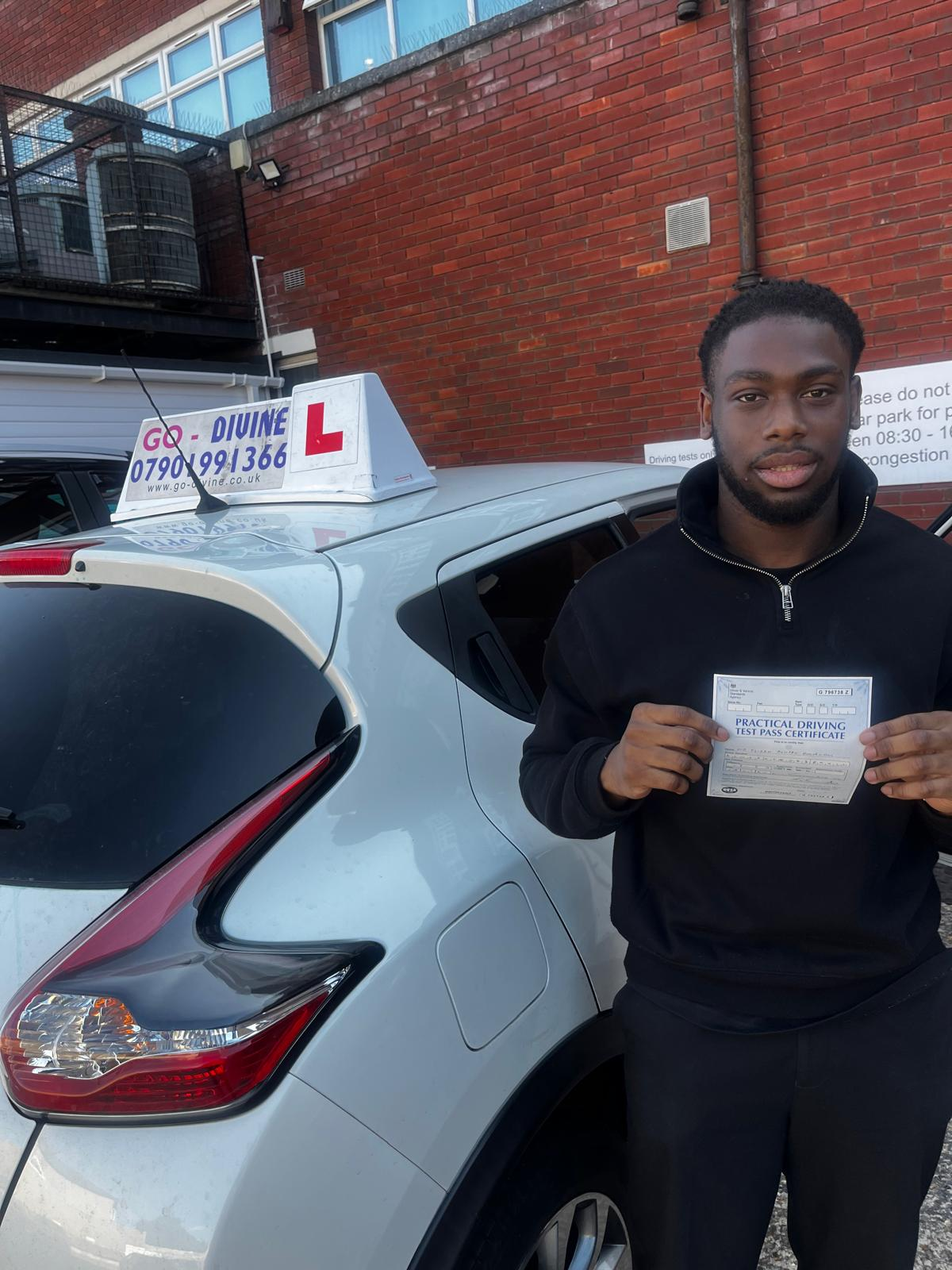 Proud student showing driving test pass certificate