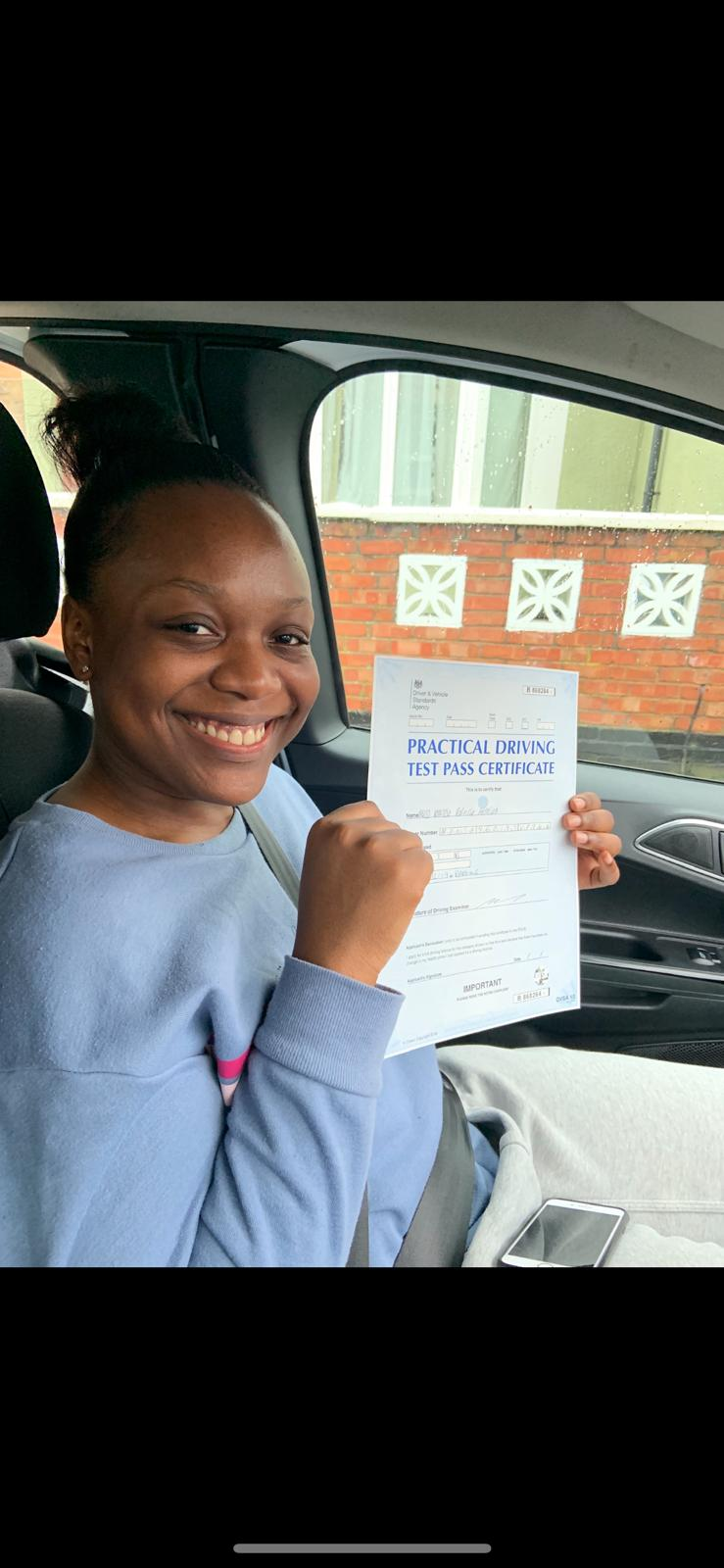 Excited student celebrating driving test pass