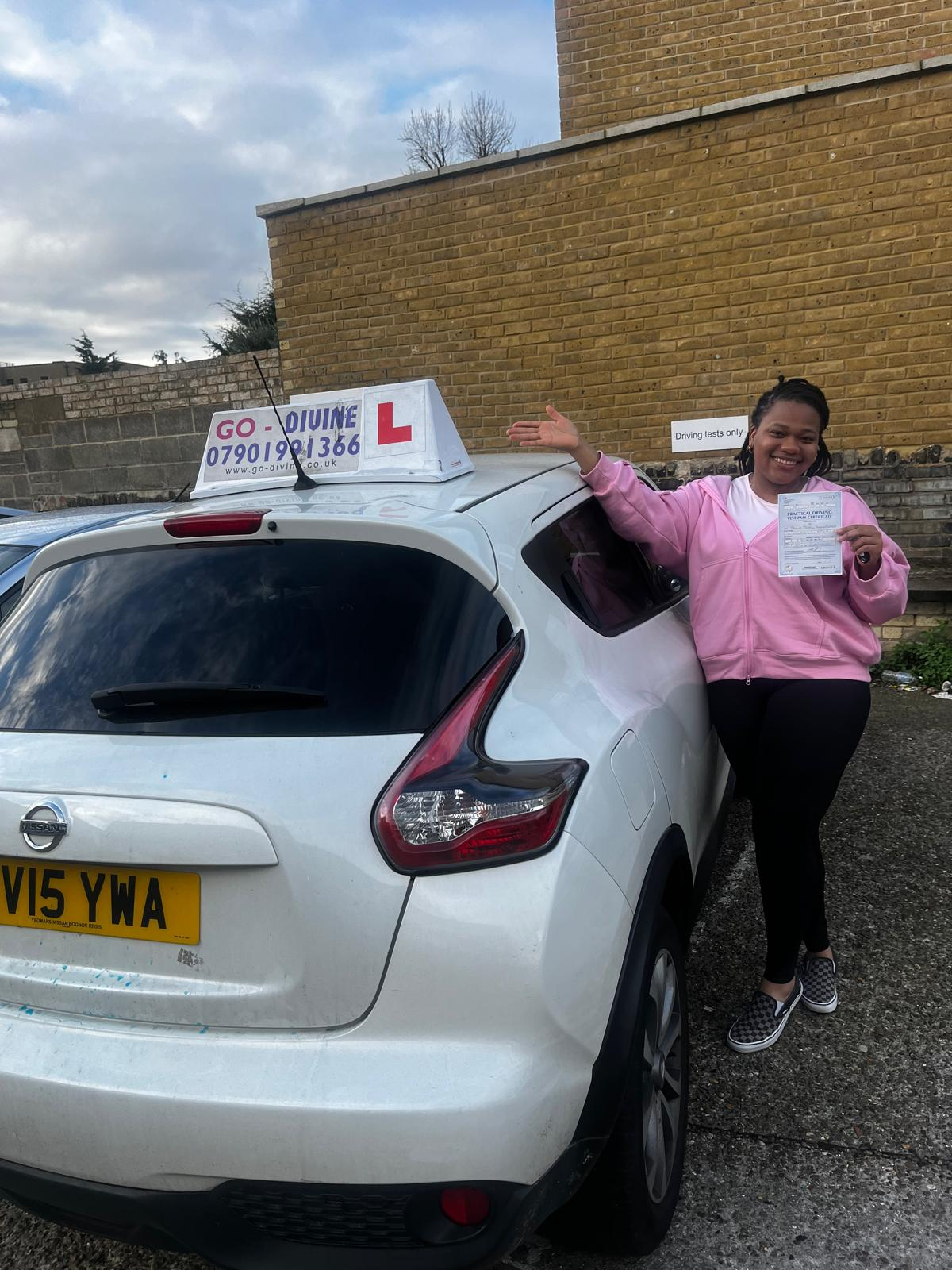 Celebrating student with driving test certificate