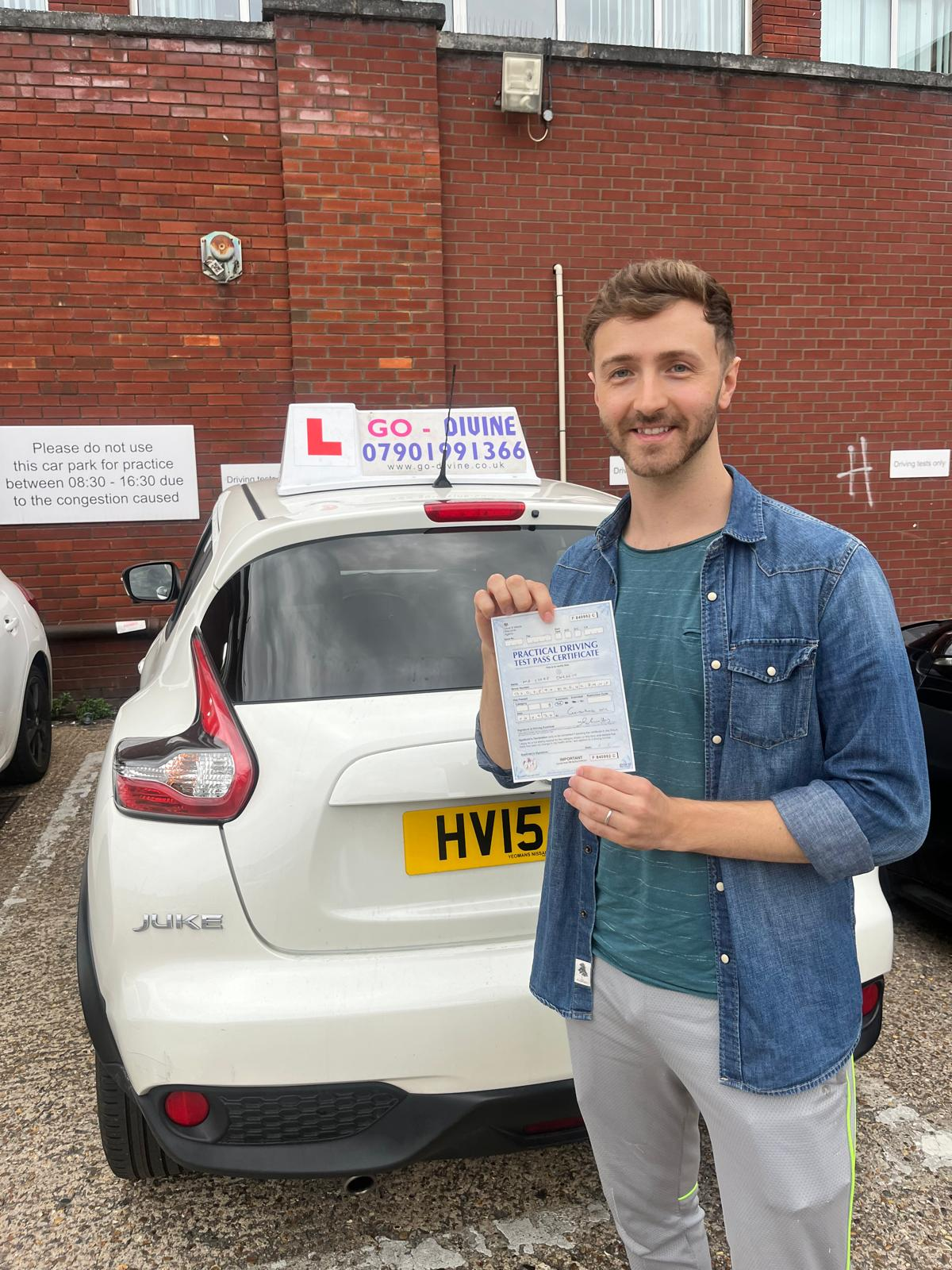 Confident student with driving test pass certificate